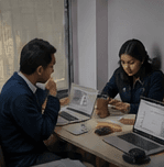 Digit Nepal team discussing a creative process at a workspace
